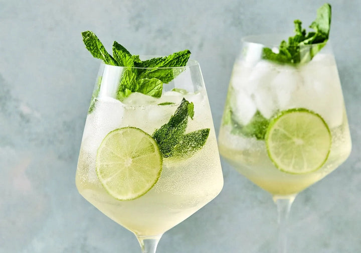Hugo Spritz cocktail with prosecco, elderflower, mint, lime, and ice