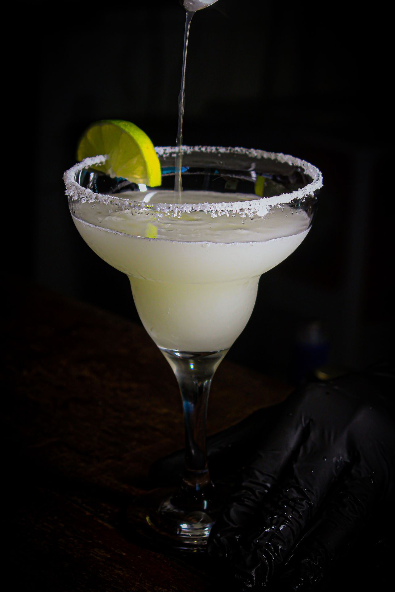 Classic frozen margarita with salt rim and lime slice